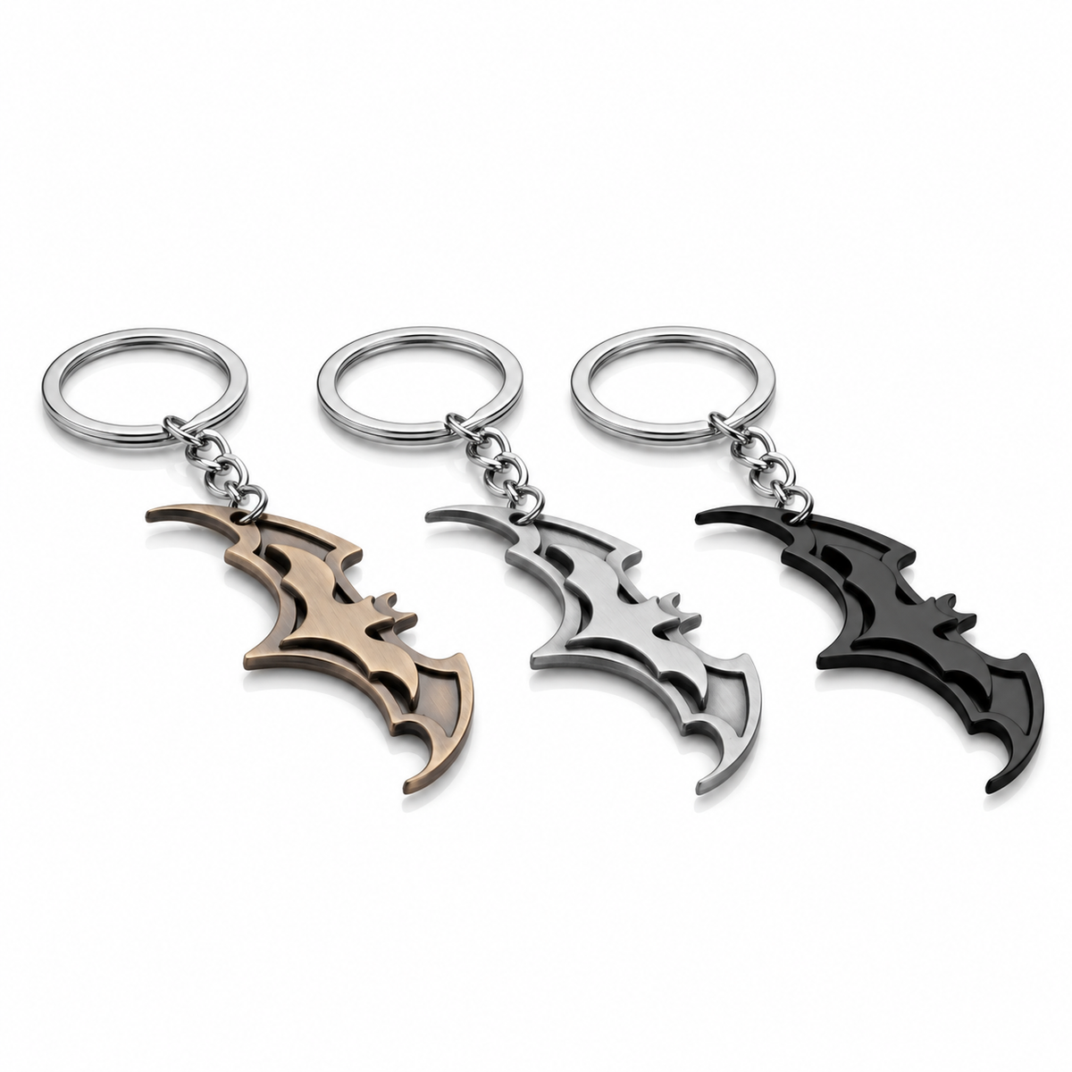 Batman Batarang keychain finish comparison: gold tone, silver tone and black; sold individually