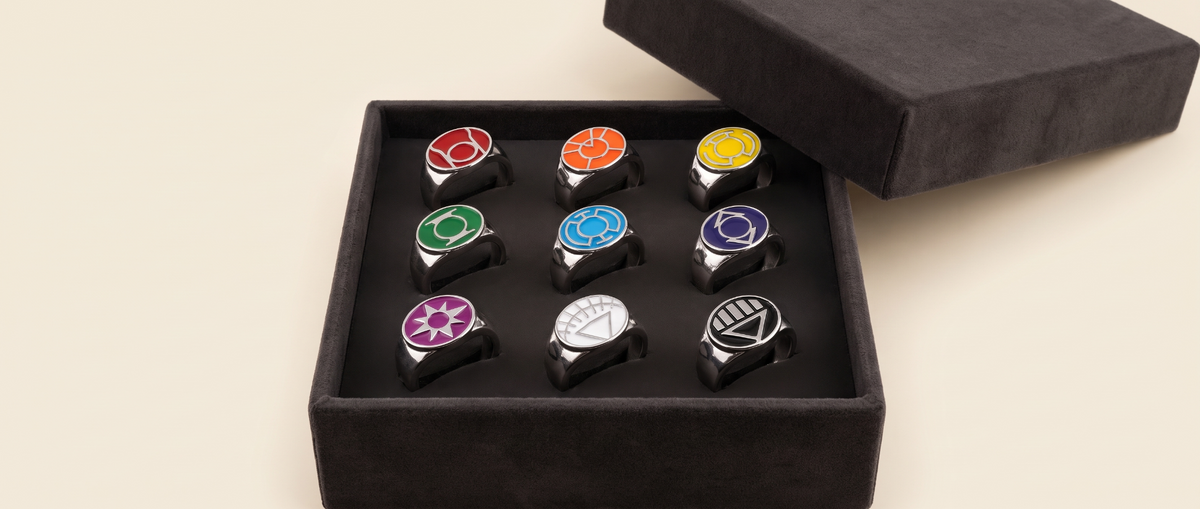Nine standard Lantern power rings arranged in three rows in a charcoal display box; presentation box not included